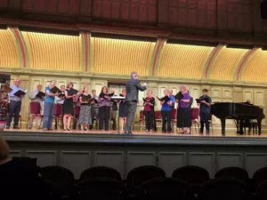 Jose Daniel Flores-Caraballo conducting Albany Pro Musica singers