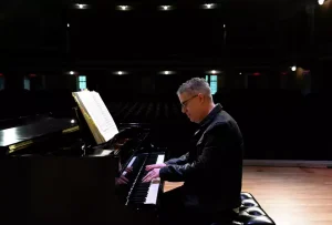 Jose Daniel Flores-Caraballo, conductor and artistic director of Albany Pro Musica, performs on the piano at Troy Savings Bank Music Hall on April 10, 2024, in Troy.
